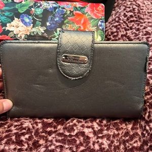 grey buxton wallet has been used